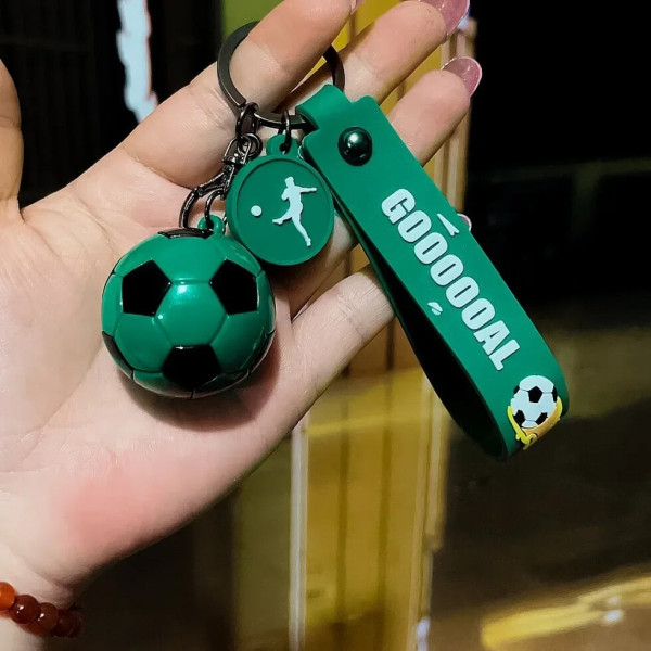 Брелок у вигляді футбольного м'яча з ремінцем "GOOOOAL" та спортивним дизайном